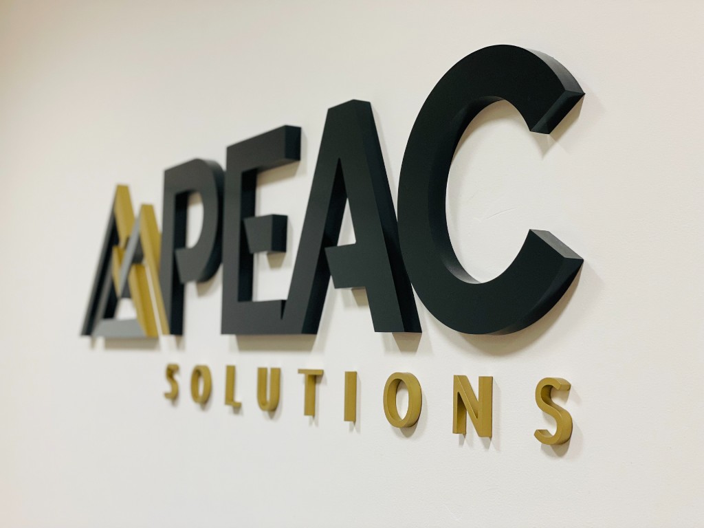 APEAC Solutions 3D wall lettering with brushed metal and gold finishes