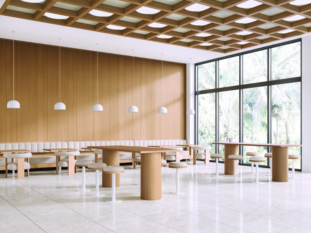 Hall with wood-wrapped walls, tables and coffered ceiling