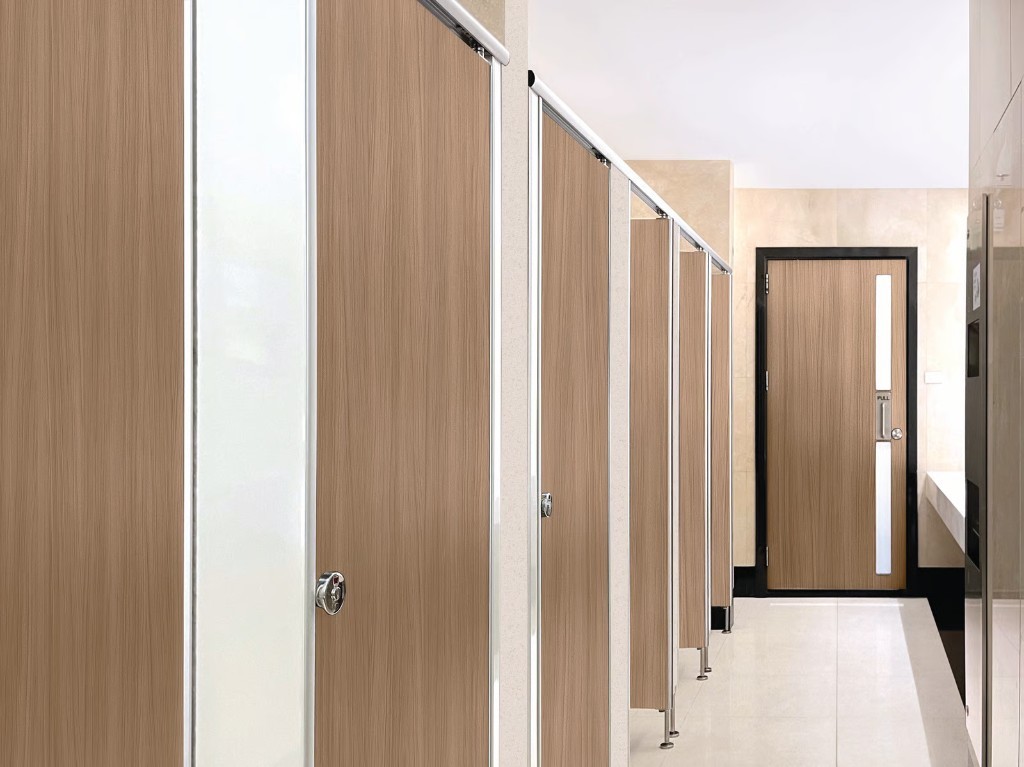 Wood-effect architectural wrap on restroom cubicle doors