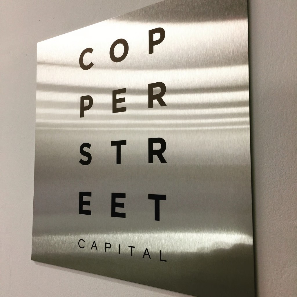 Copper Street Capital brushed metal plaque with stacked typography