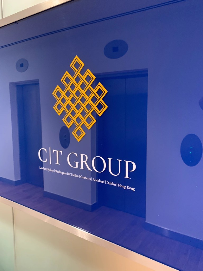 Blue glass plaque with gold logo