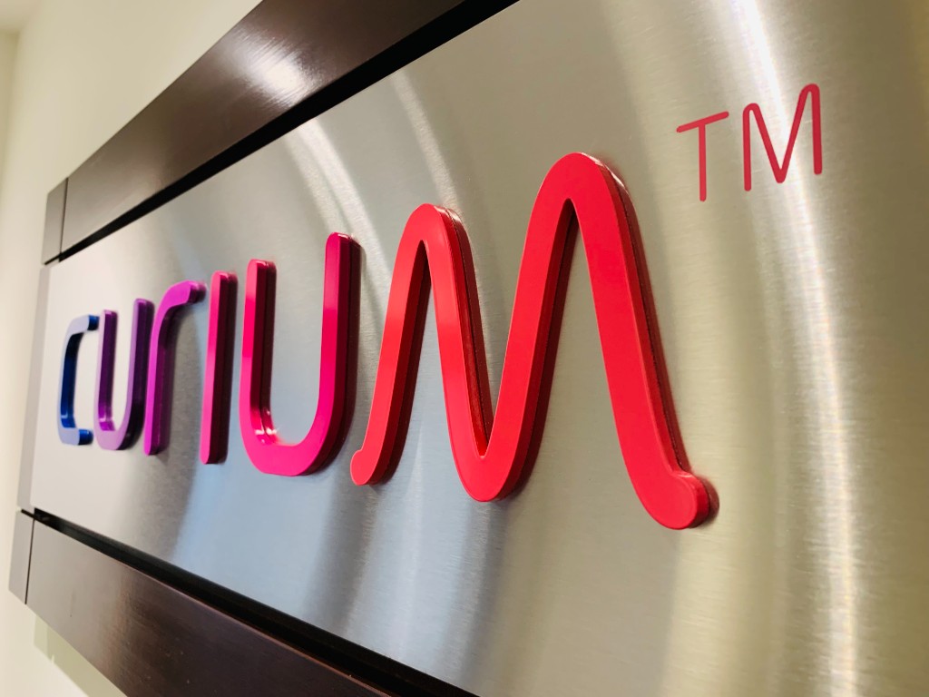Curium gradient Perspex lettering on brushed metal