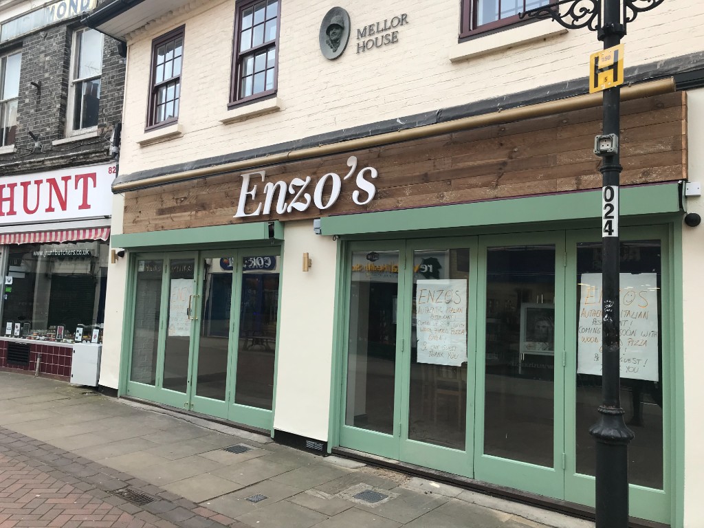 Enzo's wooden fascia with white dimensional lettering