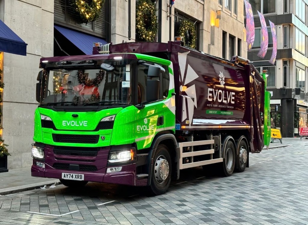 Evolve Waste Scania truck with lime and purple fleet wrap in London