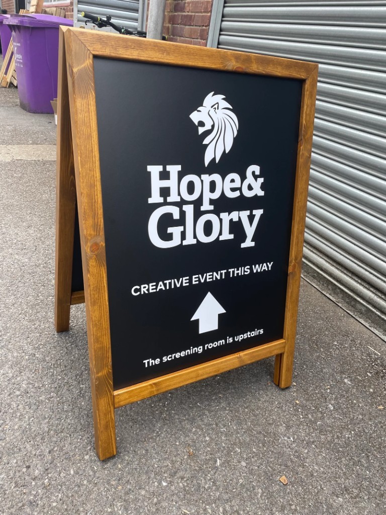 Hope & Glory wooden A-board pavement sign with directional arrow