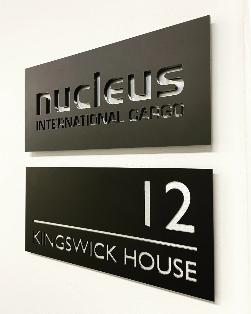 Nucleus and Kingswick House cut-through metal plaques