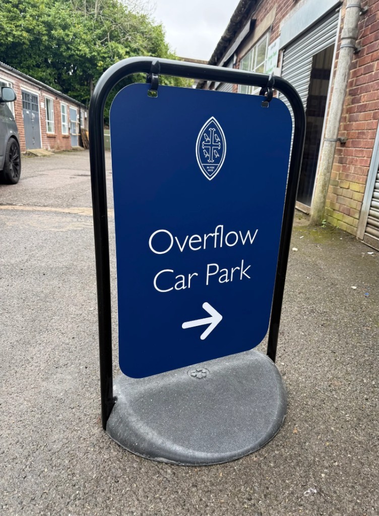 Overflow Car Park directional swinger sign on a weighted portable frame