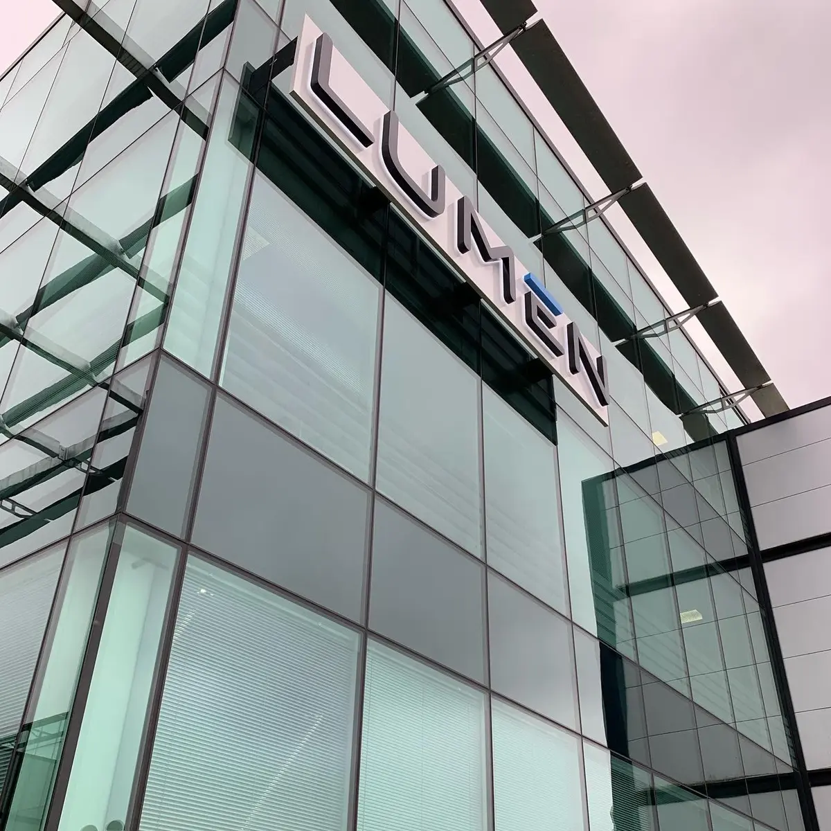 Architectural signage integrated with a building exterior