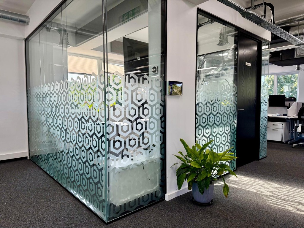 Frosted hexagon window manifestation on office glass partitions