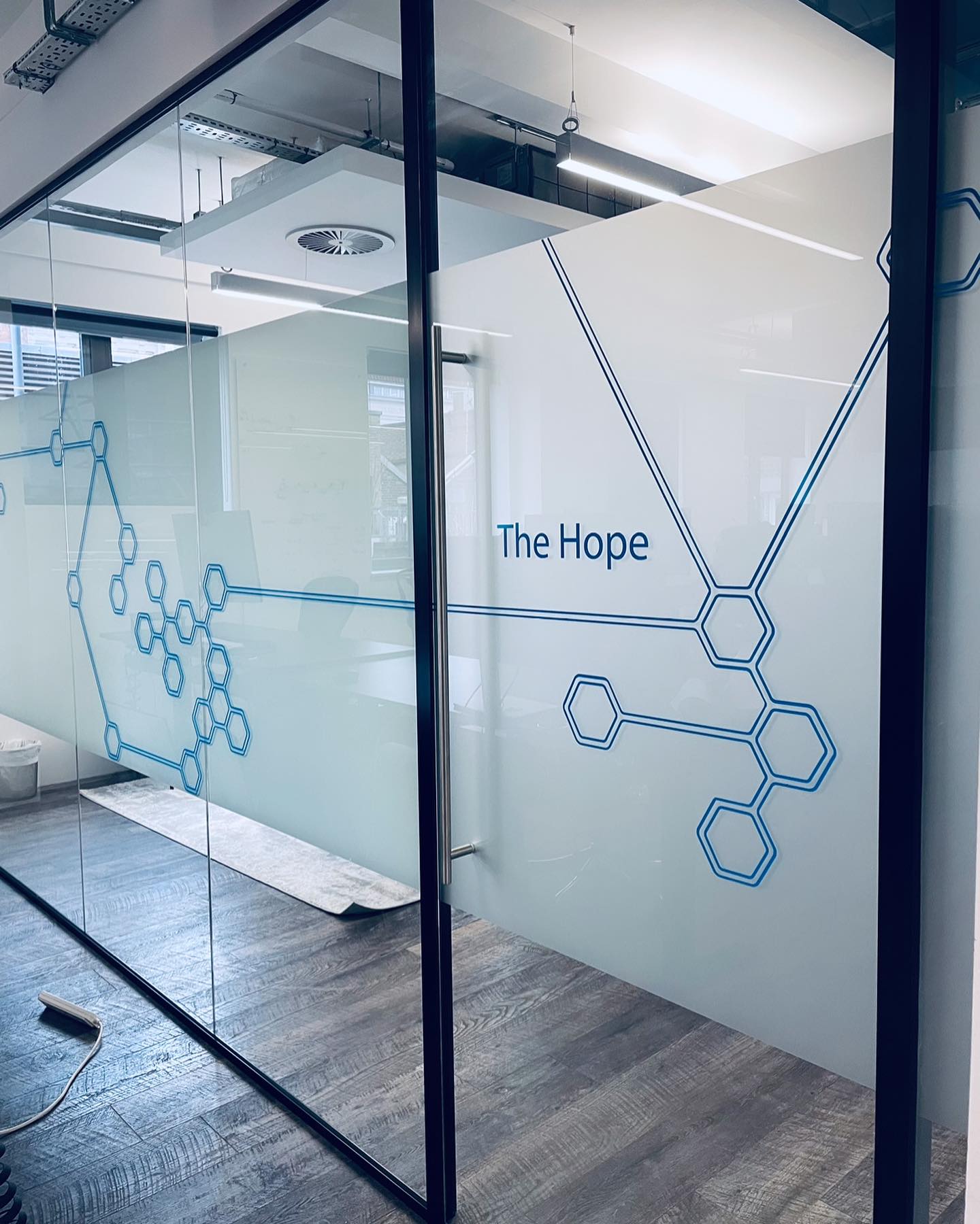Frosted and coloured vinyl graphics for a client in London .