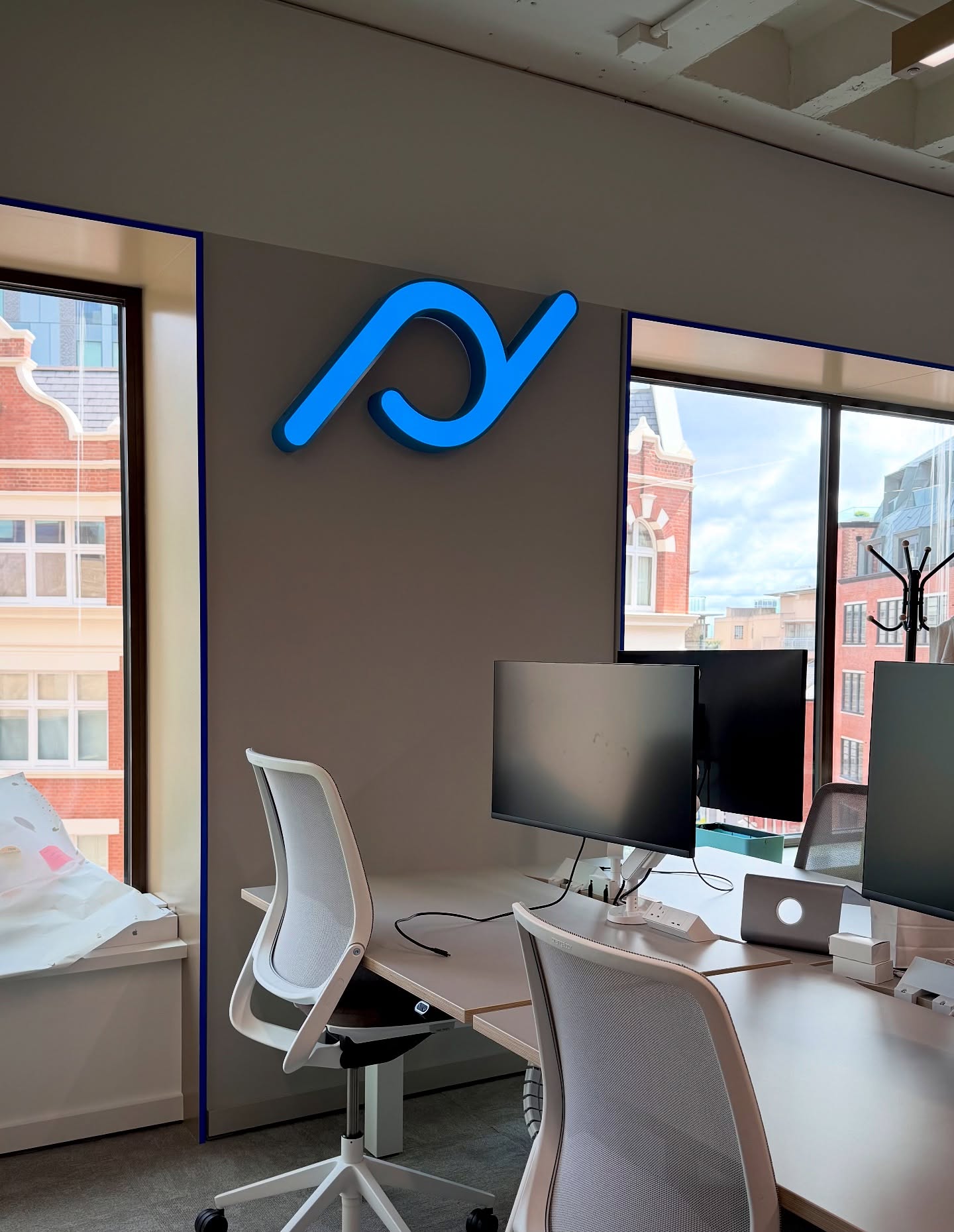 Illuminated signage for PlanDay in London.